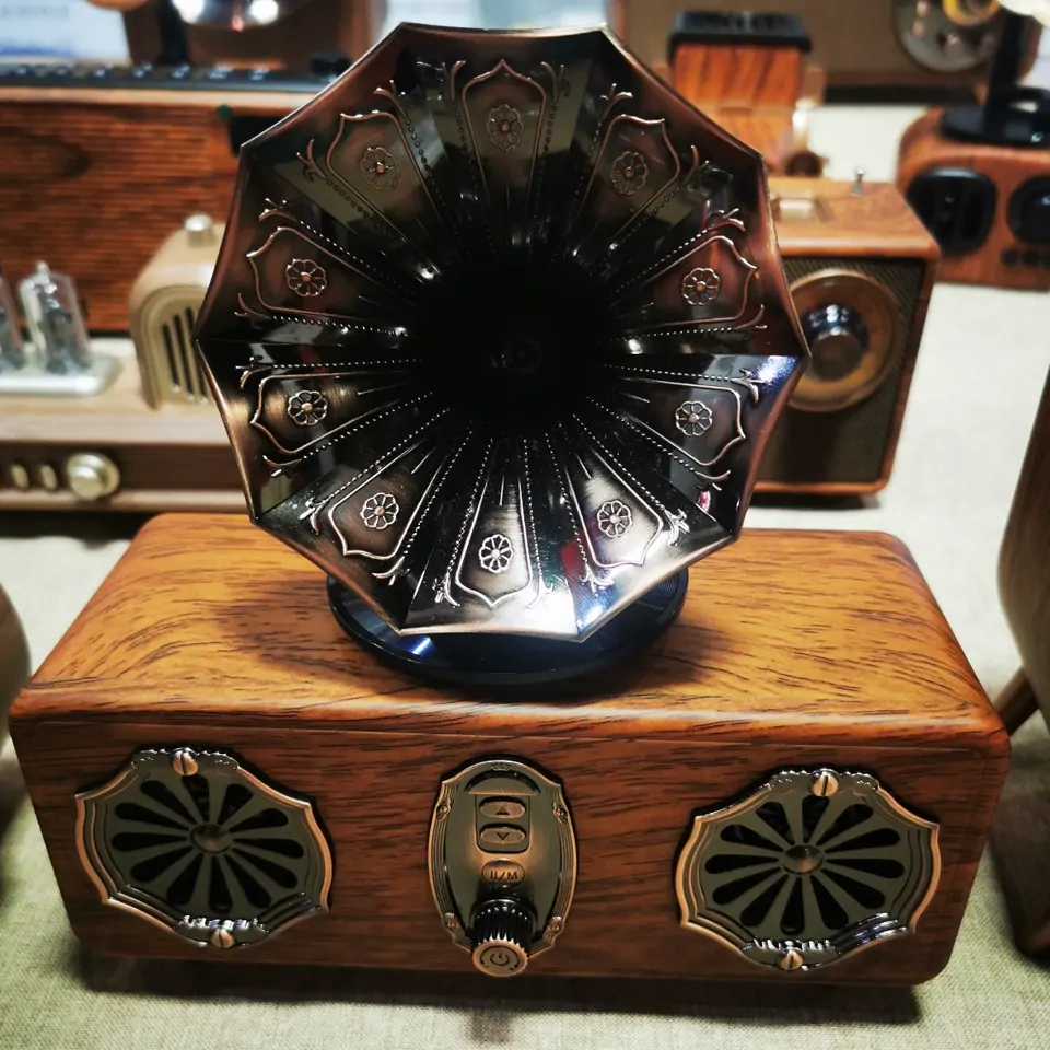 Vintage-style gramophone speaker horn and wood-finish cabinet detail