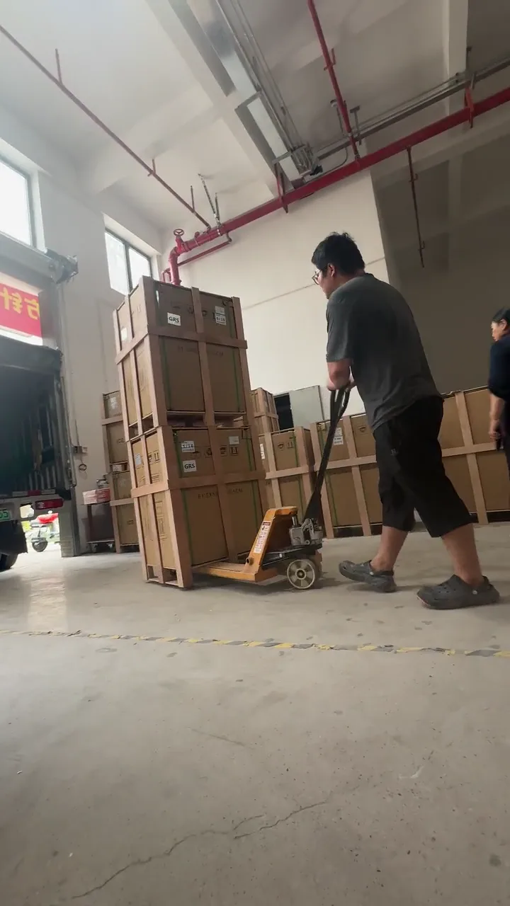 Wooden-crated cargo being moved by pallet jack for loading preparation in China