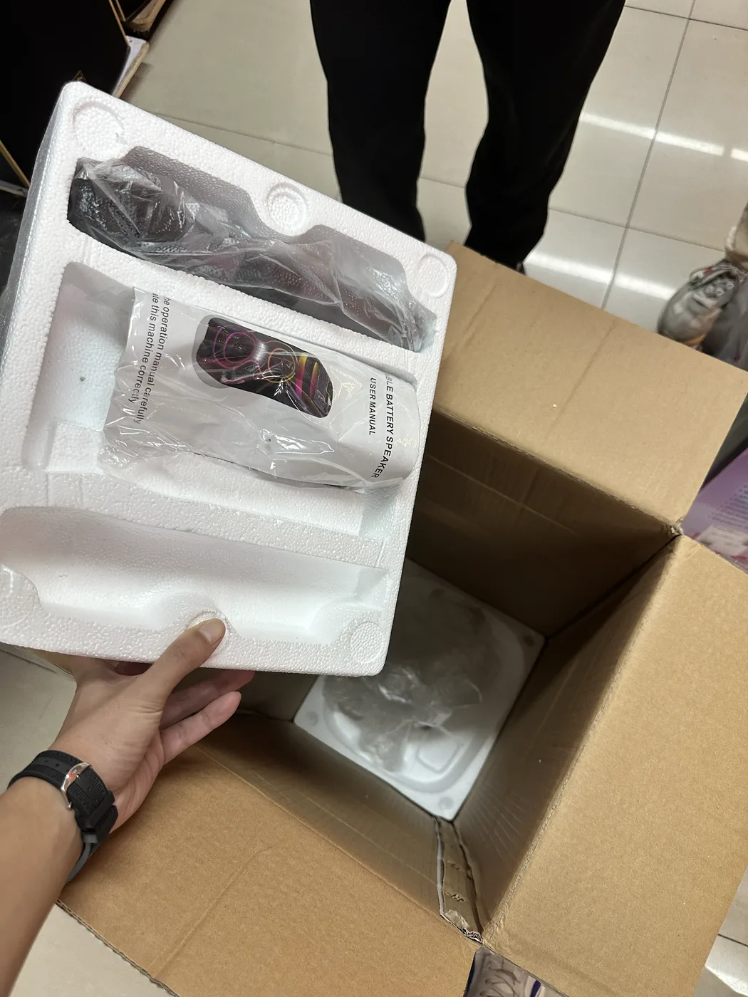 Speaker package opened to verify the product, manual, accessories and protective packing